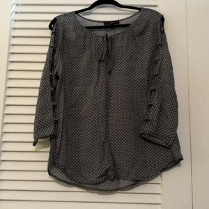 Bare arm polka dot blouse